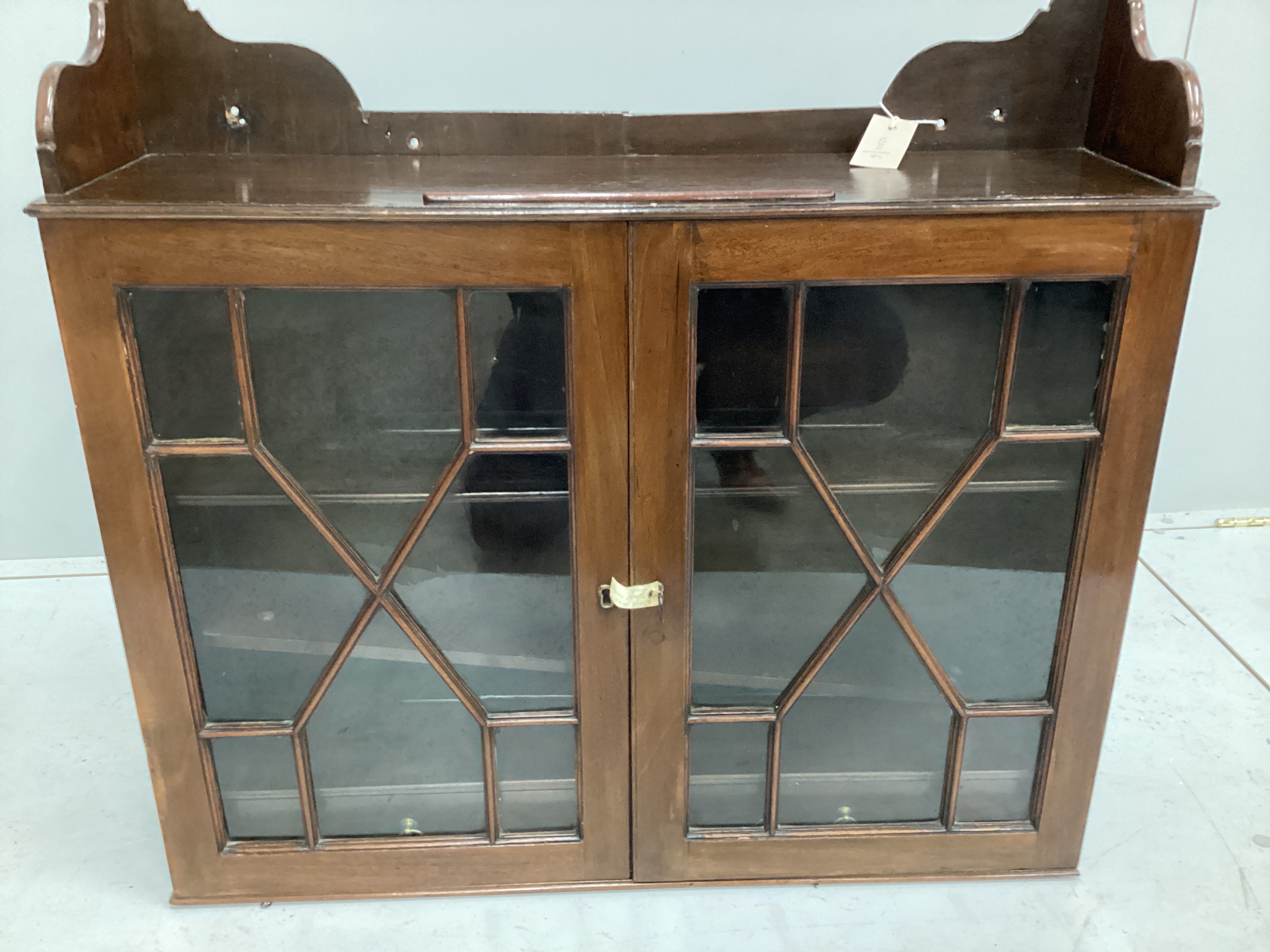A George III style glazed mahogany wall cabinet, width 77cm, depth 20cm, height 72cm